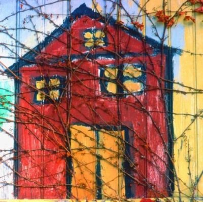 Mural of a red house with vines growing across it